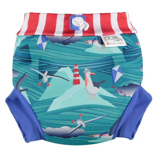 Close Swim Nappy with Albatross print shown from the front with a red-and-white striped waistband, blue leg cuffs and a teal print featuring albatross birds, waves and a lighthouse.