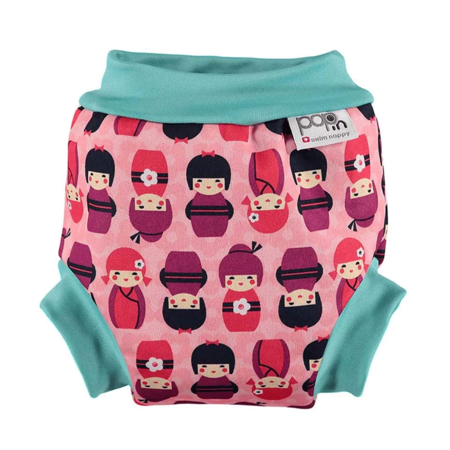 Close Swim Nappy in Retro Kokeshi Dolls shown from the front with a teal waistband and leg cuffs, featuring a pink patterned print with stylised doll characters.