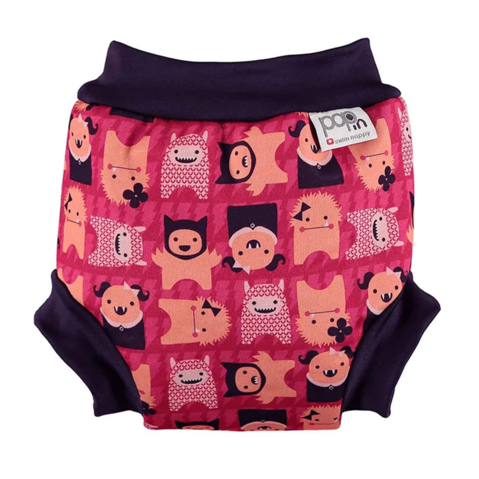 Close Swim Nappy with Monster Edie print shown from the front with a dark waistband and a pink patterned print featuring playful monster characters.