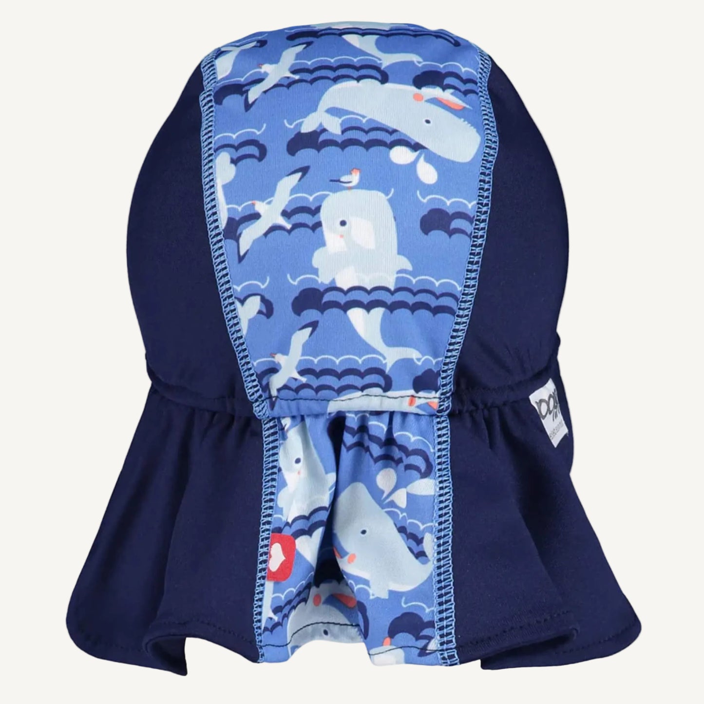 A toddler sun hat shown from the back with a central whale-patterned panel and a wide extended neck cover in deep navy.