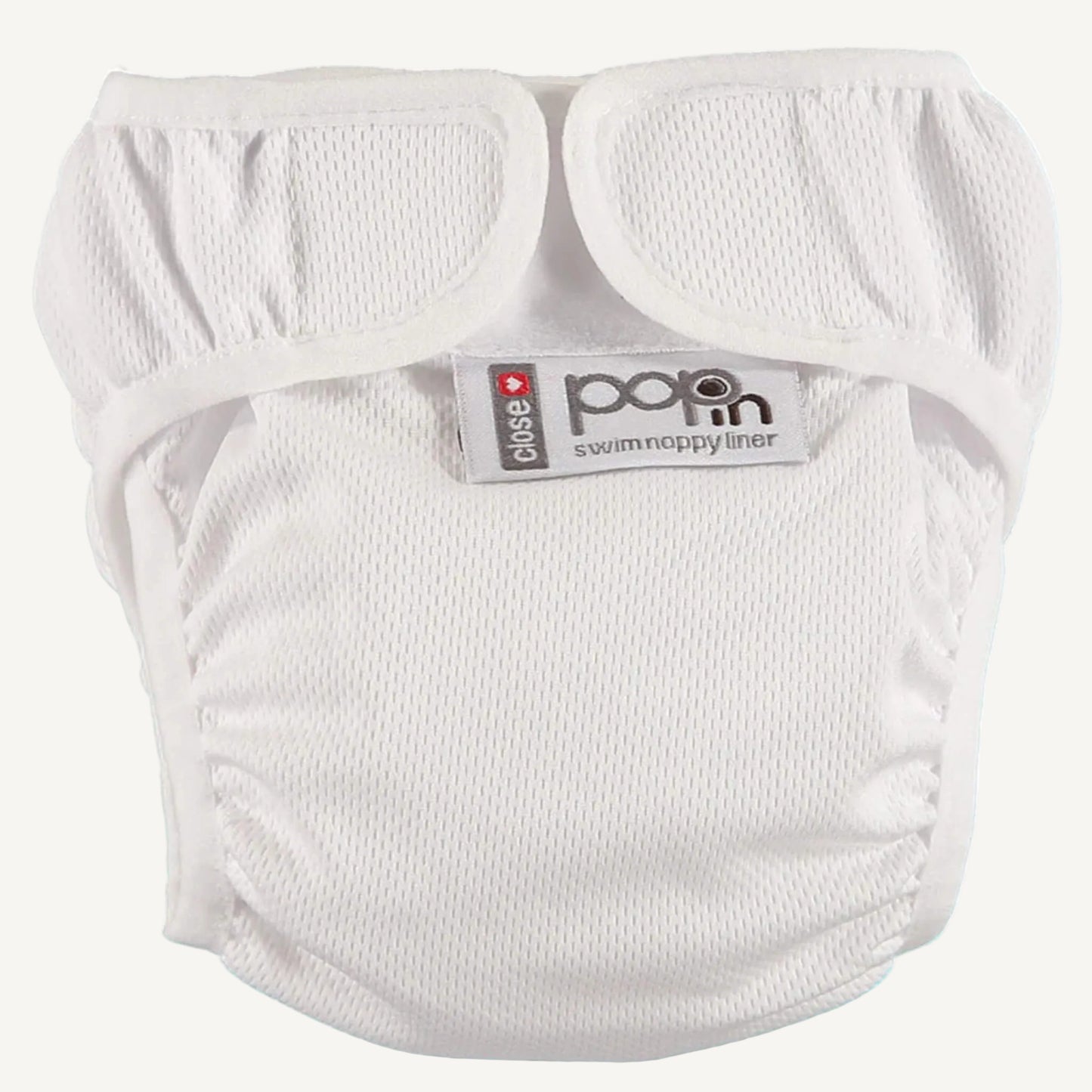 A white swim nappy liner displayed with its fastening tabs opened, showing the soft interior fabric and lightly textured outer surface. The leg openings are elasticated and gathered for comfort and containment.