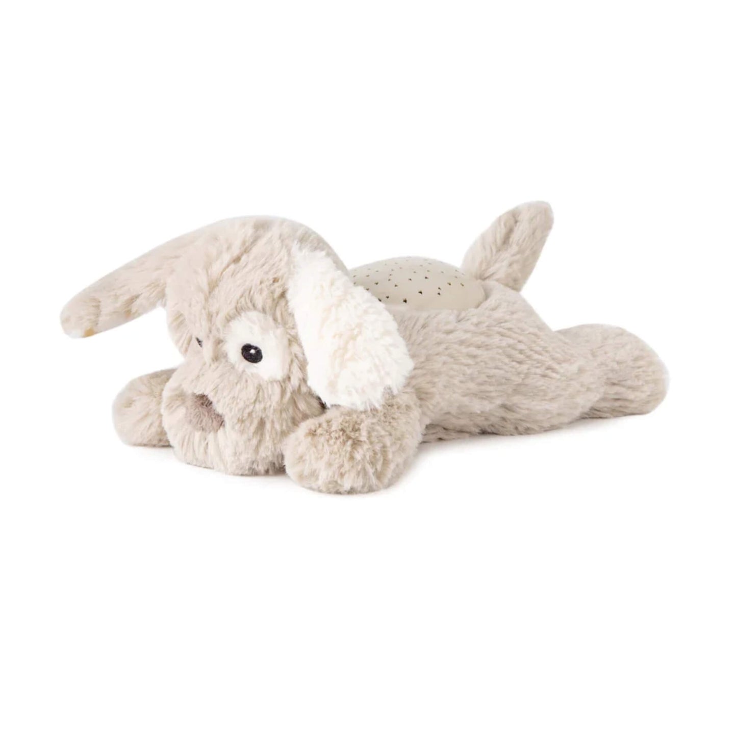 Side view of a plush puppy toy in a lying position, showing the circular night-light projector on its back and its soft floppy ears.