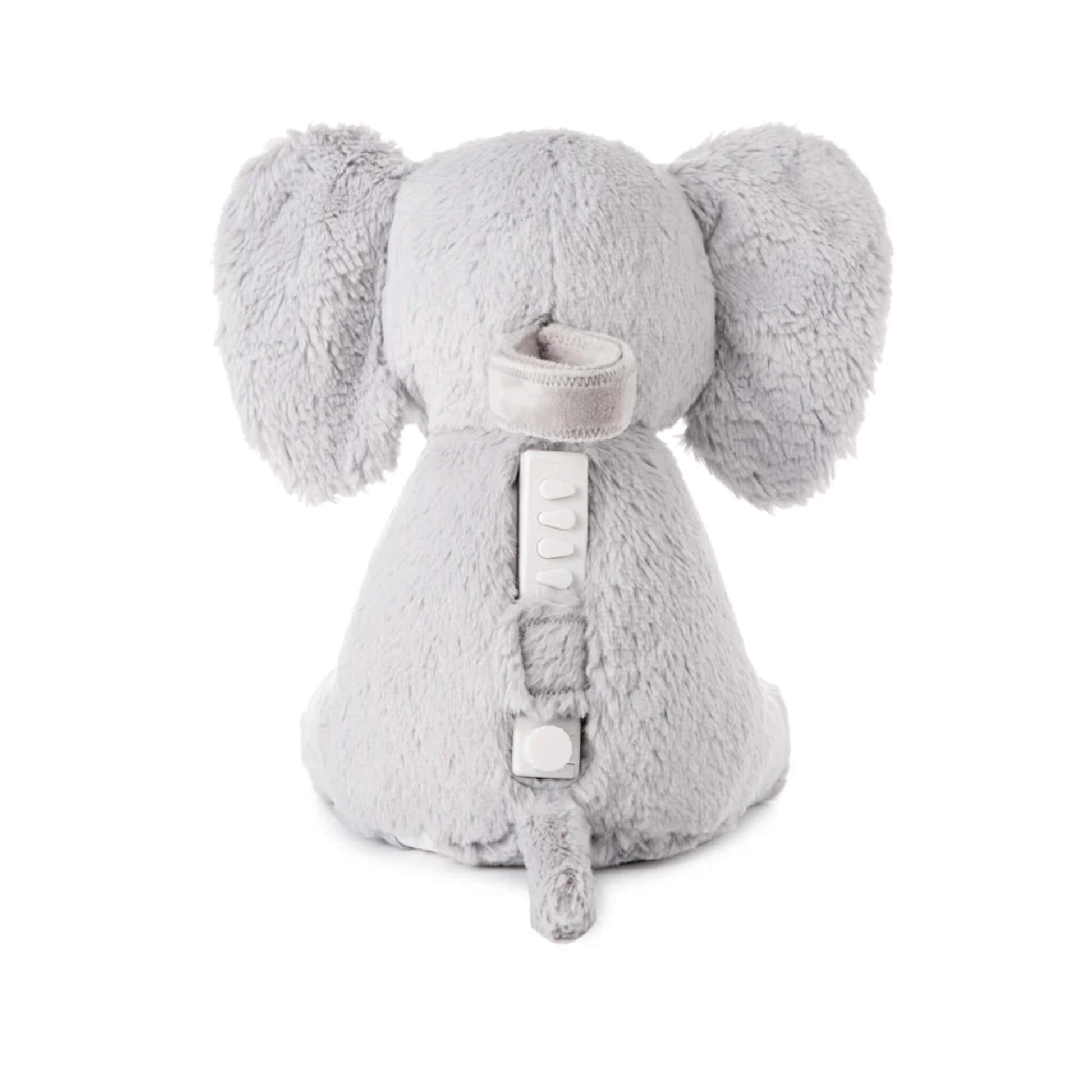 Back view of soft elephant toy showing fabric compartment with strap and inserted sound module, designed for easy access and secure closure.