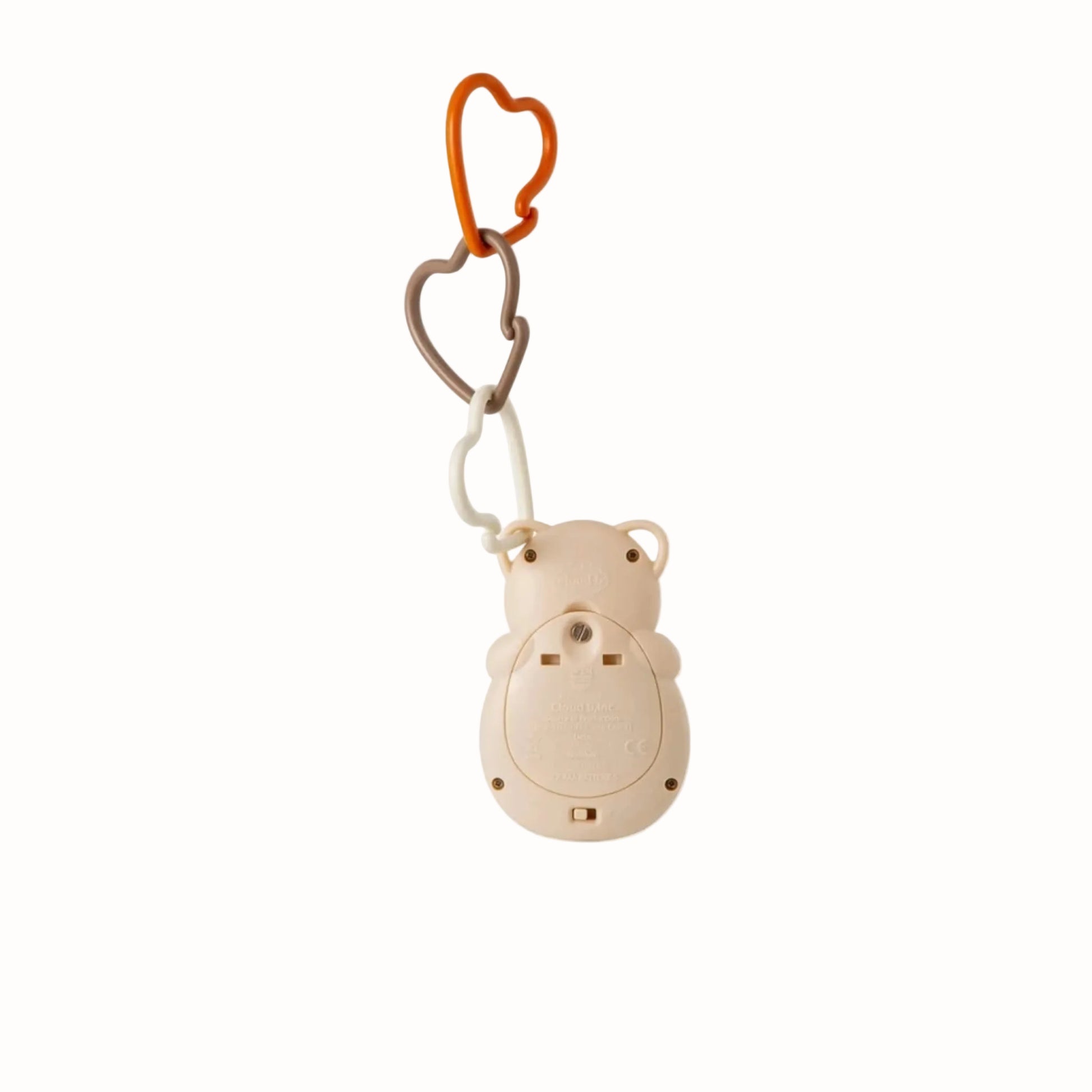 Rear view of an owl portable sound machine showing the battery compartment and heart-shaped attachment links.