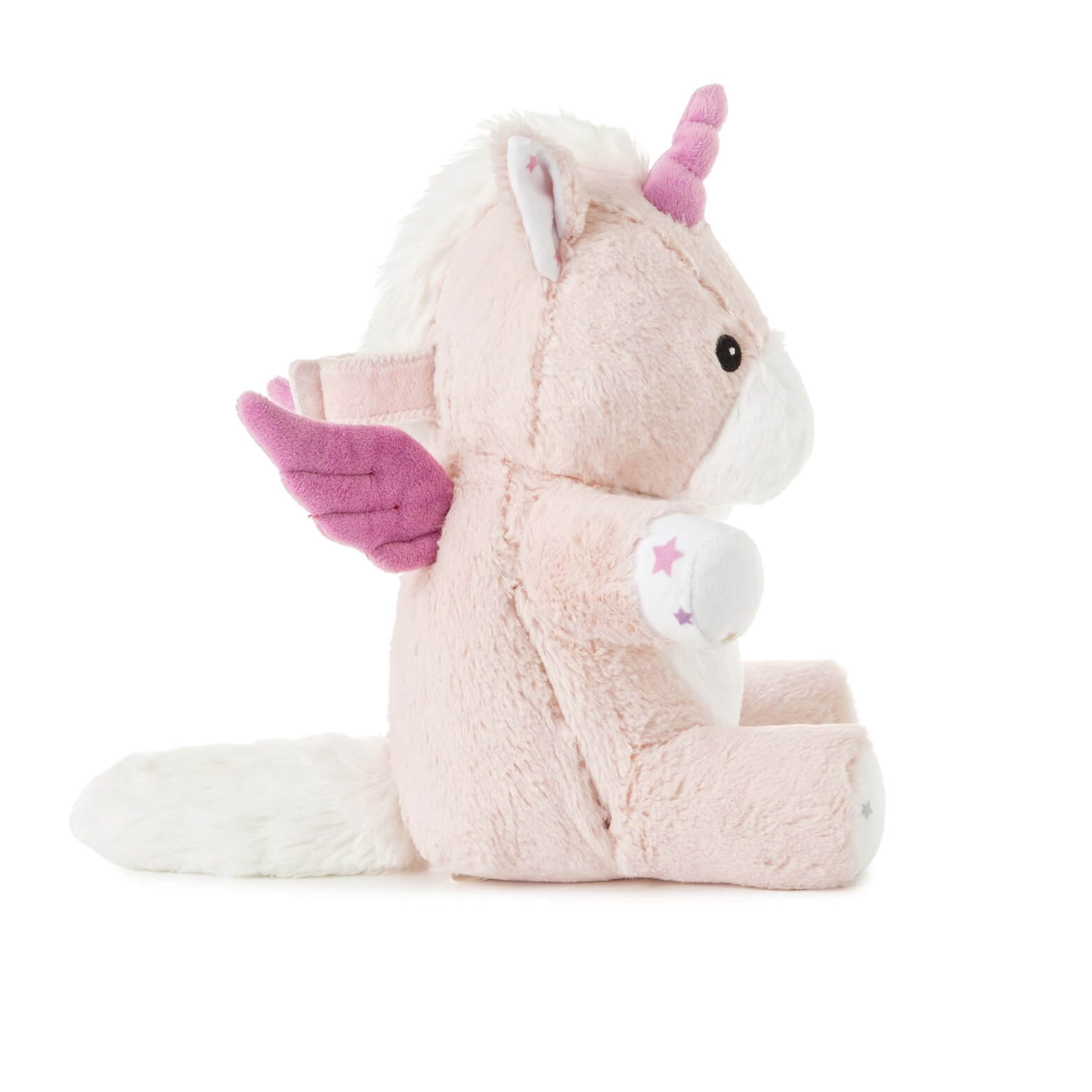 Side profile of a soft unicorn toy with pink wings, star patterns on its hooves and a fluffy white tail.
