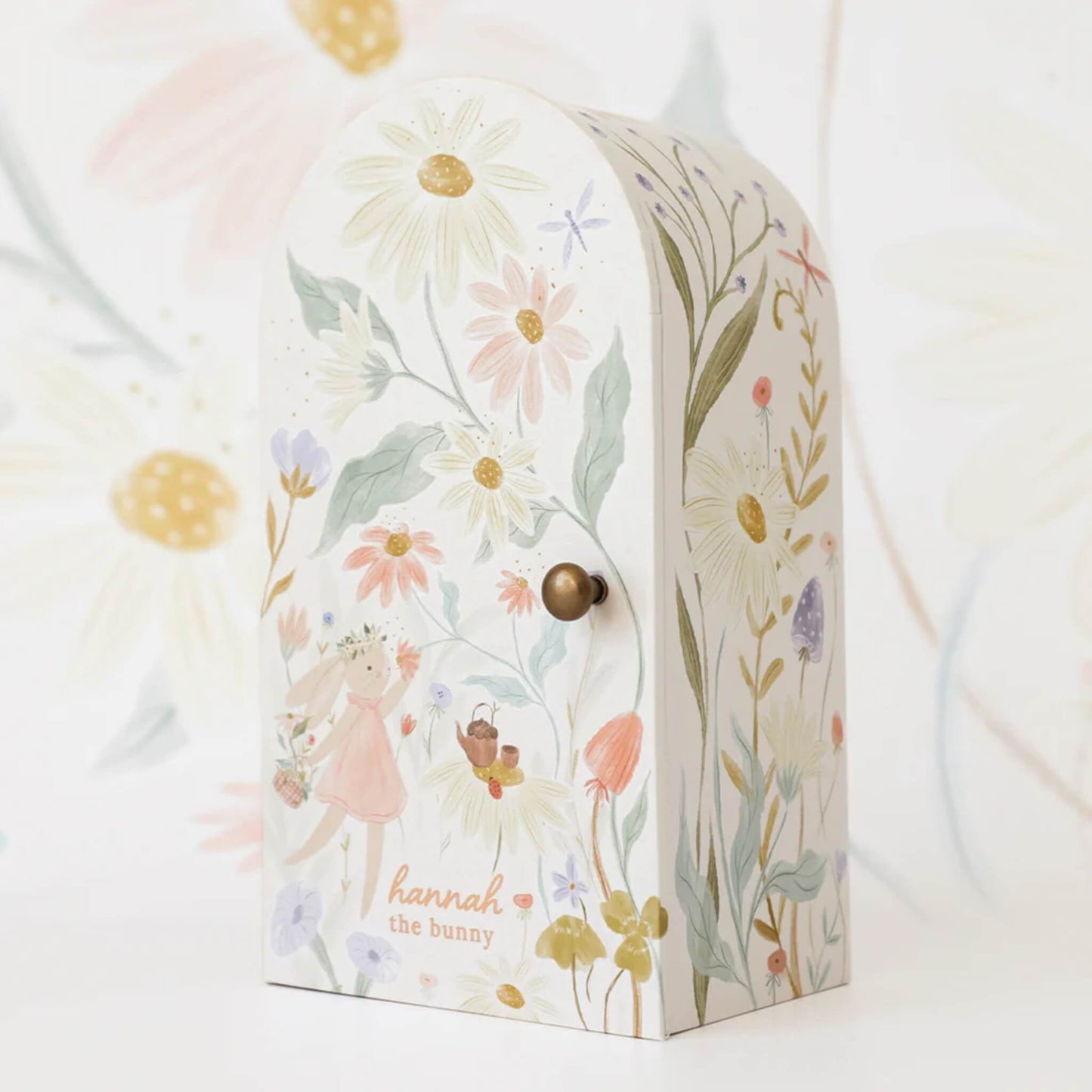 Floral illustrated keepsake box with pastel wildflower design and rounded top, shown closed with small knob.