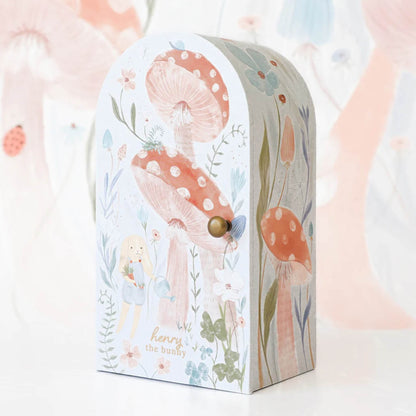 Illustrated keepsake box with mushroom and woodland design, featuring soft pastel tones and rounded top shape.