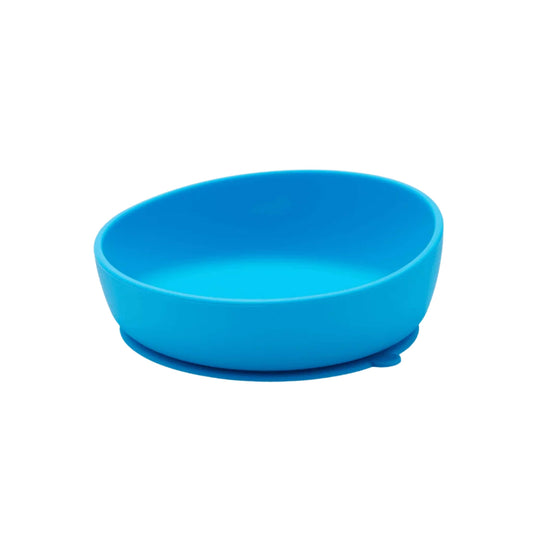 A blue Doidy Bowl shown from an angled view, featuring the brand’s signature slanted design and a suction base to help reduce spills during baby-led weaning.