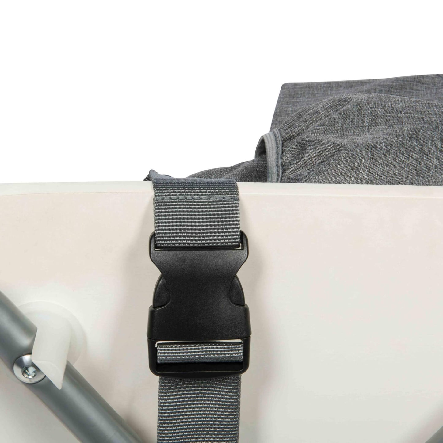 A close-up of a grey strap with a black plastic buckle fastened underneath a white chair seat.