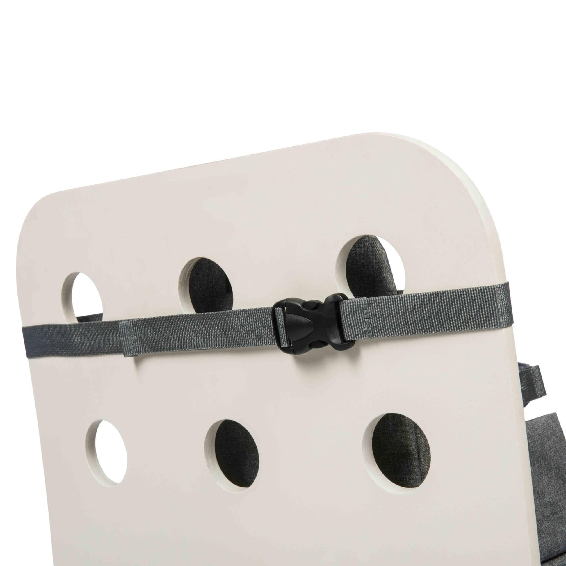 A grey safety strap with a black buckle wrapped around the backrest of a white chair.