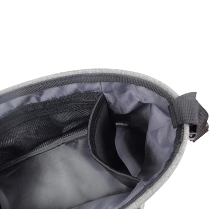 Close-up of interior side pocket and mesh pocket inside a grey buggy organiser.