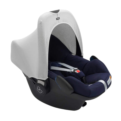 A Dooky Car Seat Hoody in grey fitted to a navy infant car seat, creating shade and UV protection while adding a fresh new look.