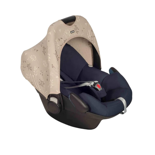 A Dooky Car Seat Hoody in a soft beige print fitted to a navy infant car seat, providing shade, UV protection and a stylish update for travel.