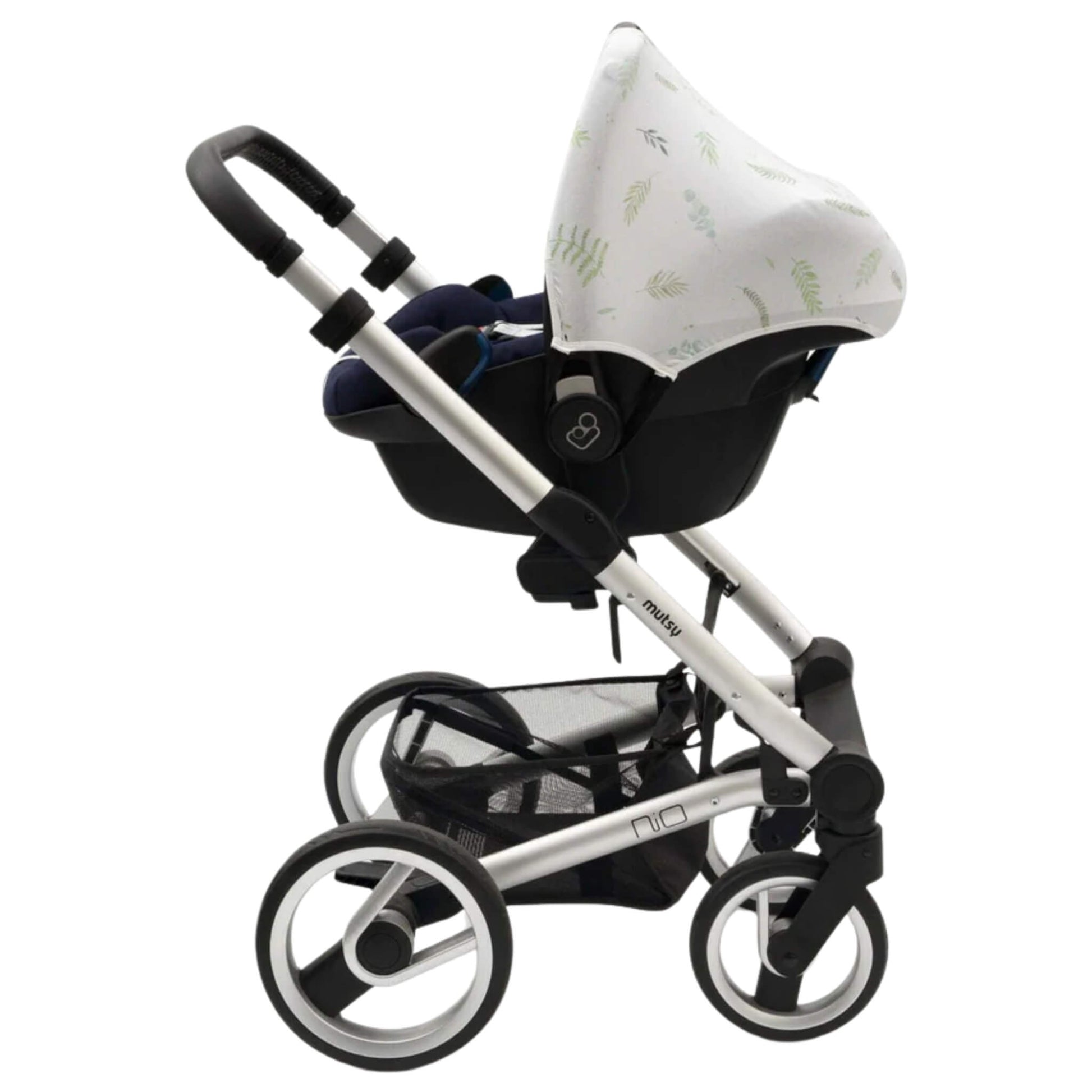 A white car seat hoody with green leafy design attached to an infant car seat placed on a silver pushchair frame, showing compatibility with a travel system.