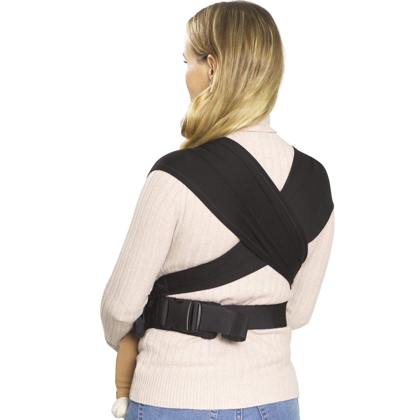 A rear view of a woman wearing a black baby carrier, showing the wide cross-over straps and adjustable waist belt.