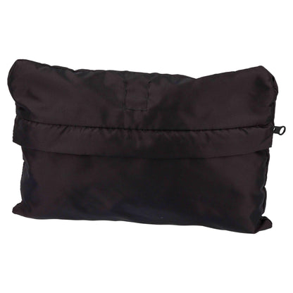 Black carrier rain cape neatly folded up into its built-in front pocket, with hood visible at the top and corner clips tucked in.