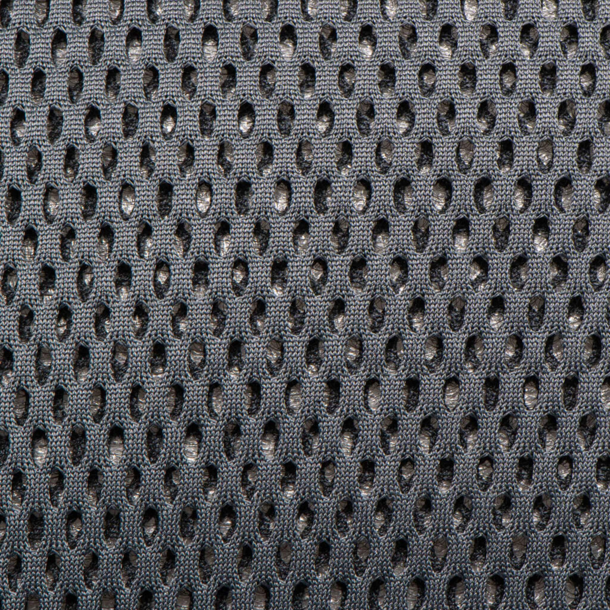 Close-up of grey breathable mesh fabric used on a baby carrier.
