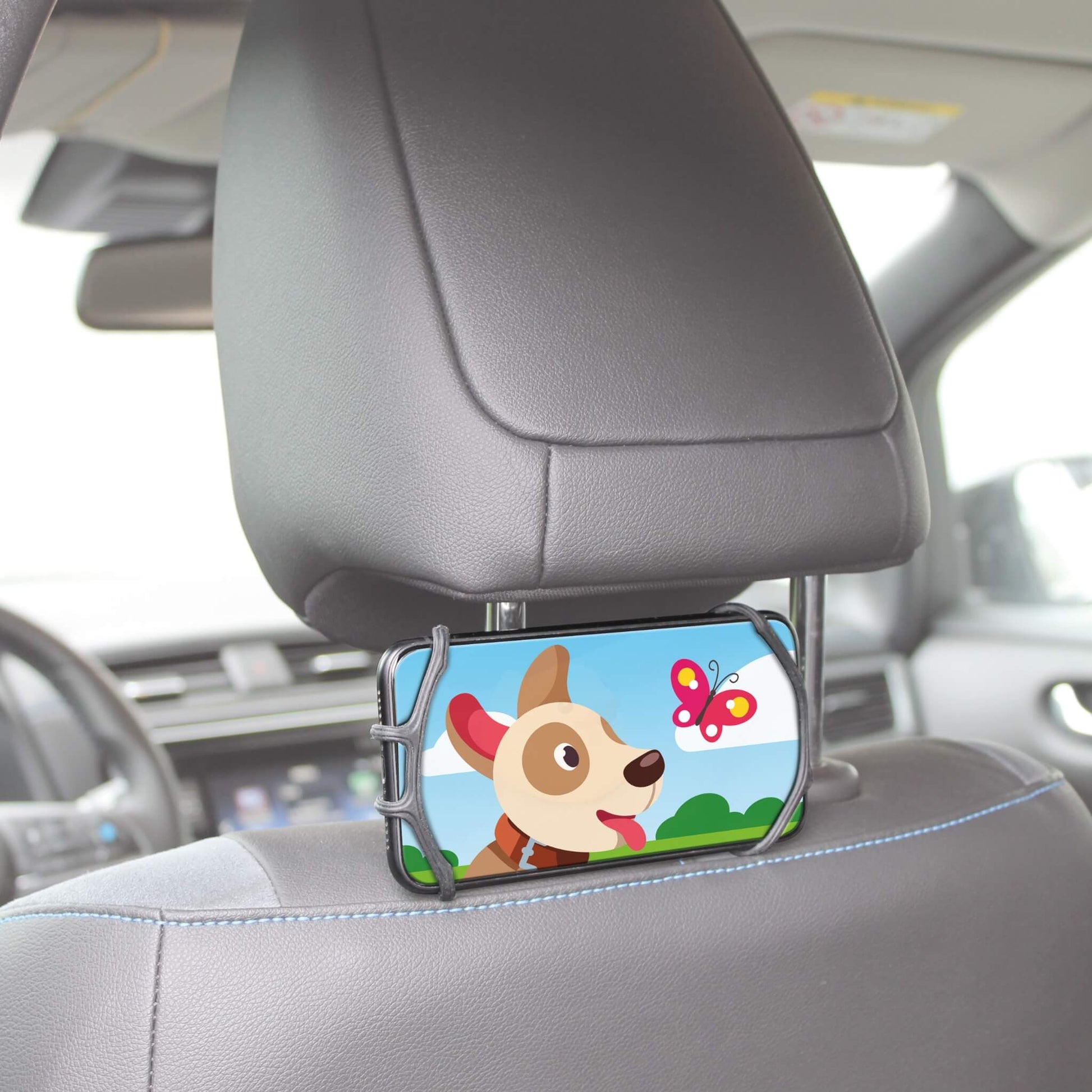 A car phone holder clip mounted on a gray car headrest, holding a smartphone with a colorful cartoon dog and butterfly screen.