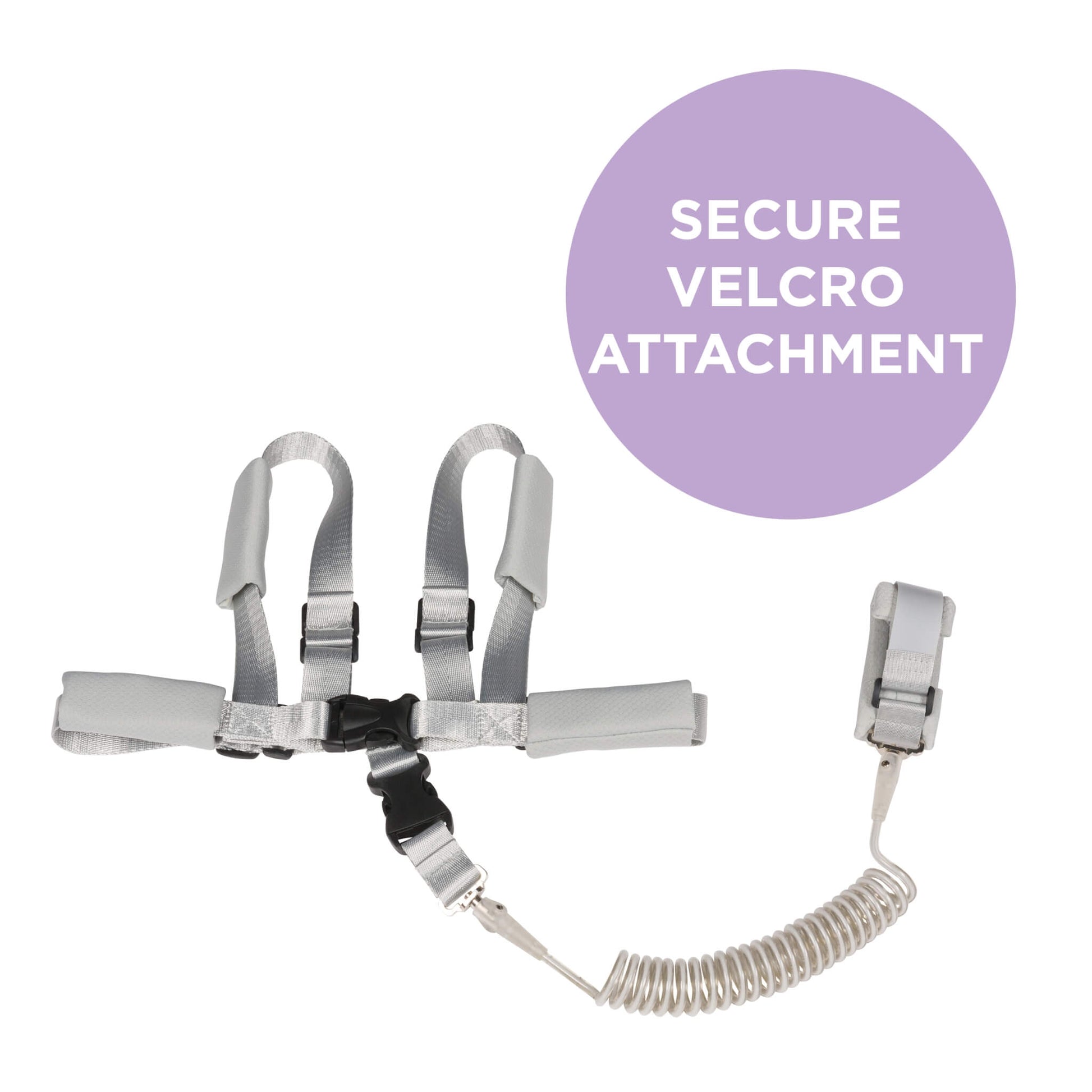 A silver safety restraint or harness with a coiled cord and attached wrist clip, shown on a white background with a purple circular callout that reads 'SECURE VELCRO ATTACHMENT'.