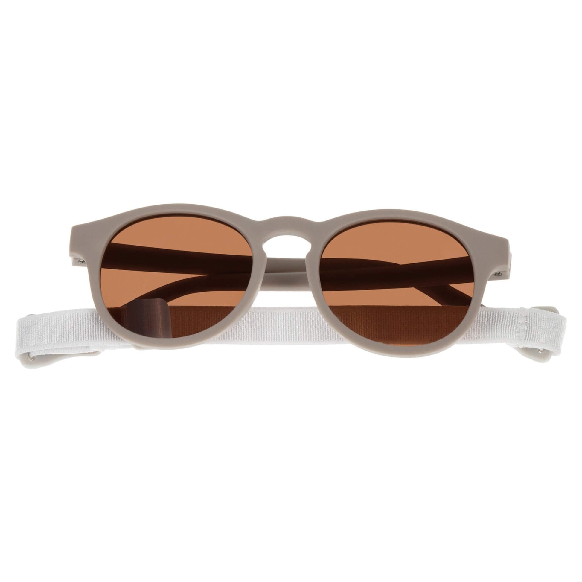 Dooky Sunglasses Aruba Taupe shown front-facing with brown lenses and a soft Pink adjustable strap, designed for babies and toddlers aged 6–36 months.