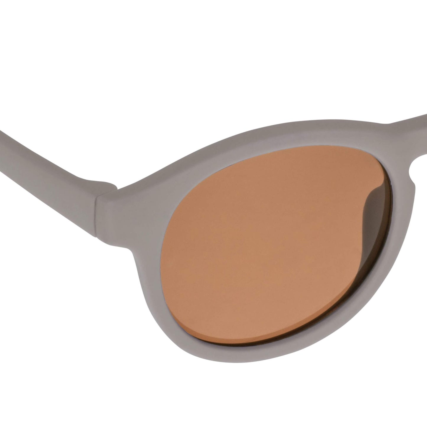 Close-up view of a taupe baby sunglasses lens showing scratch-resistant, anti-reflective brown coating.