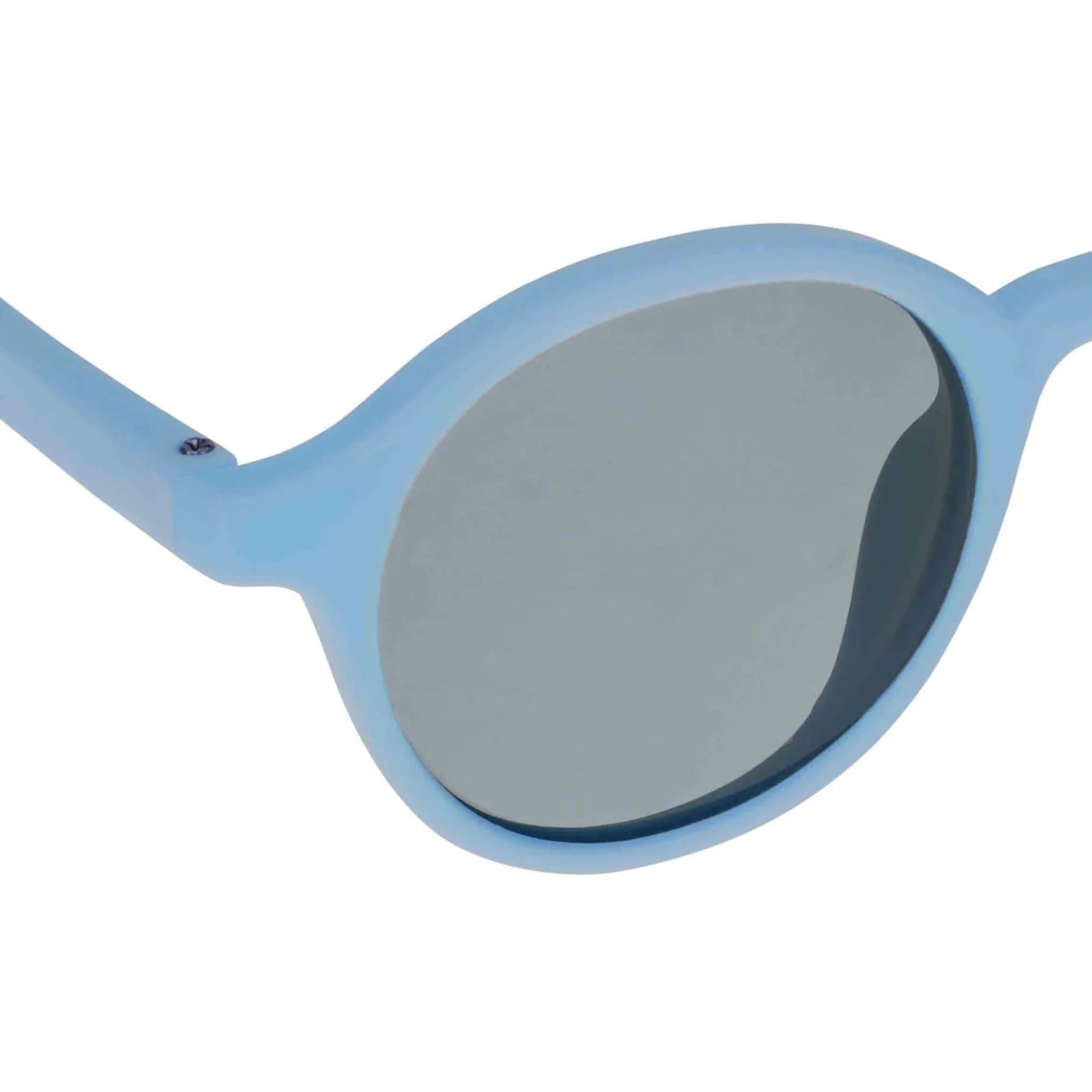 Close-up of a dark lens on a pair of blue sunglasses, clearly showing the curved frame edge and anti-reflective lens surface.