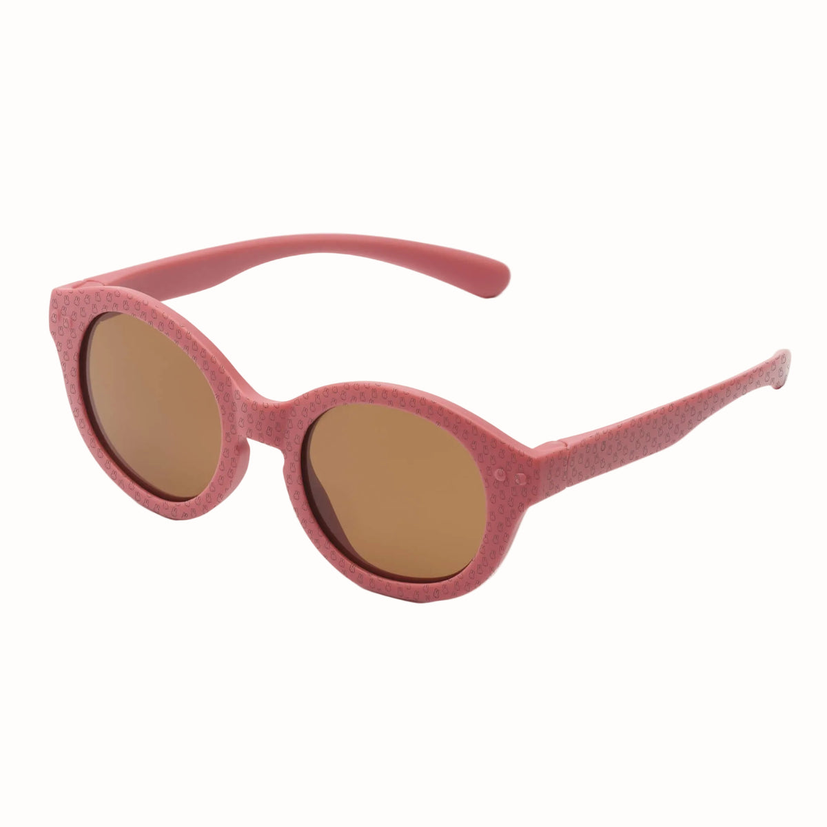 Pink children’s sunglasses with rounded brown lenses and a subtle Miffy pattern across the frames and arms.