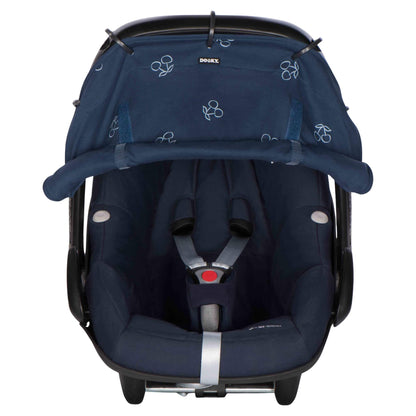 A blue cotton sunshade with white cherry print attached to an infant car seat. The fabric is rolled down and secured at the bottom, covering the seat area fully.