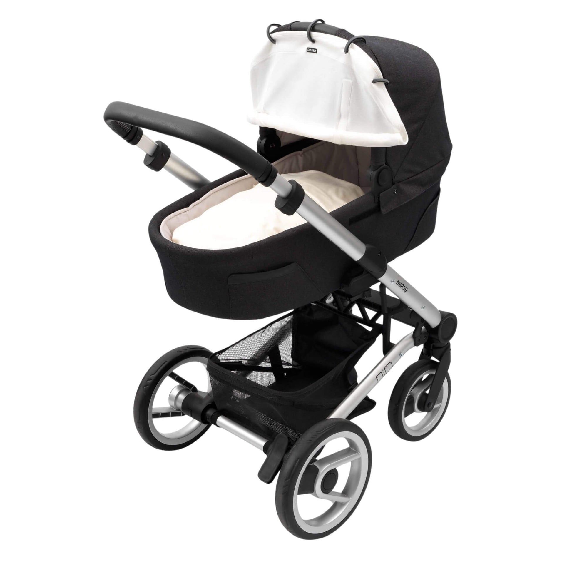 A cream sunshade fitted to a carrycot pram with black fabric and silver frame. The cover is partially rolled up and secured with Velcro.