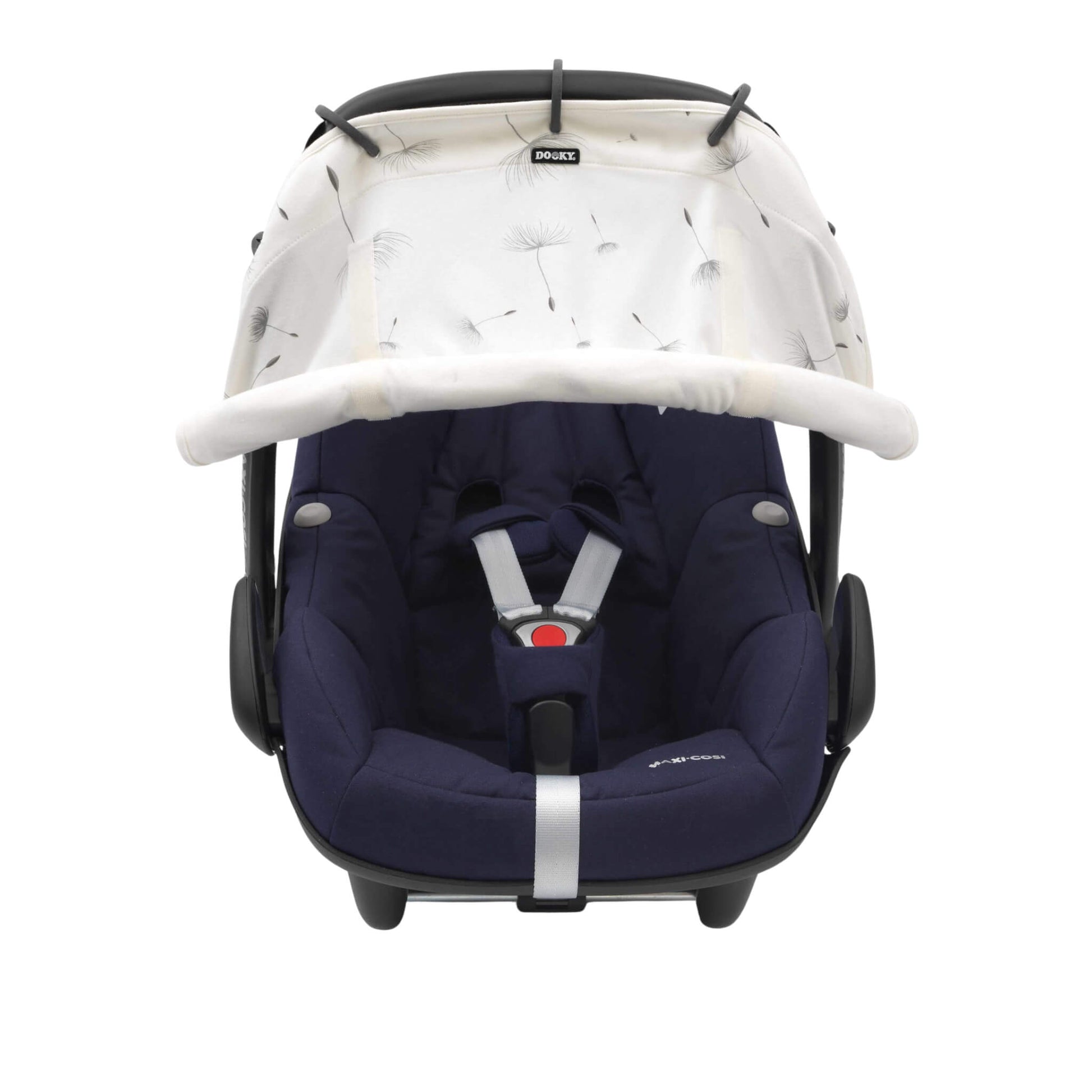 A dandelion-print sunshade in cream with black rings, attached to an infant car seat. The shade is rolled down and covers the seat’s upper front.