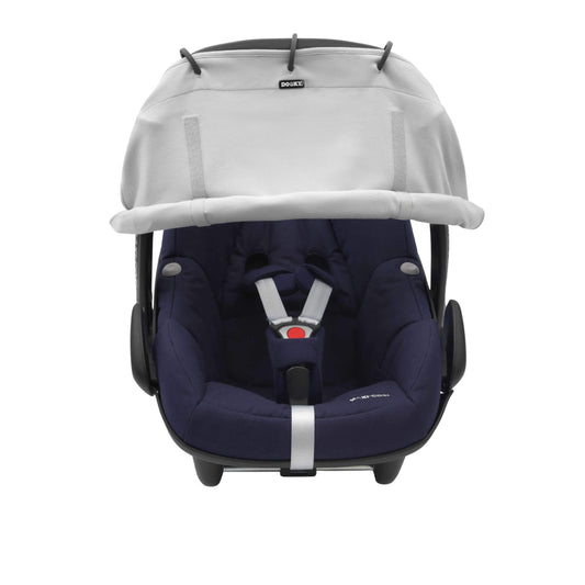 A grey sunshade attached to an infant car seat. The shade is rolled down and fixed with Velcro, covering the upper portion of the seat.