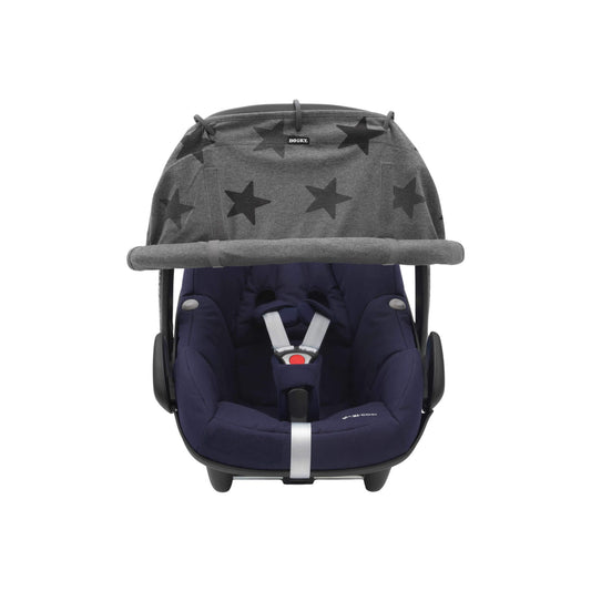 A grey stars print sunshade attached to an infant car seat. The shade is rolled down and fixed with Velcro, covering the upper portion of the seat.