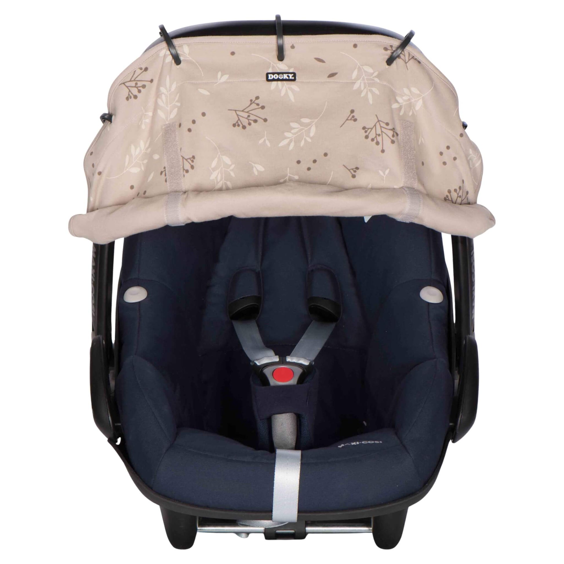 A beige leaf-print sunshade attached to a navy blue infant car seat, partially rolled up to reveal the harness area.