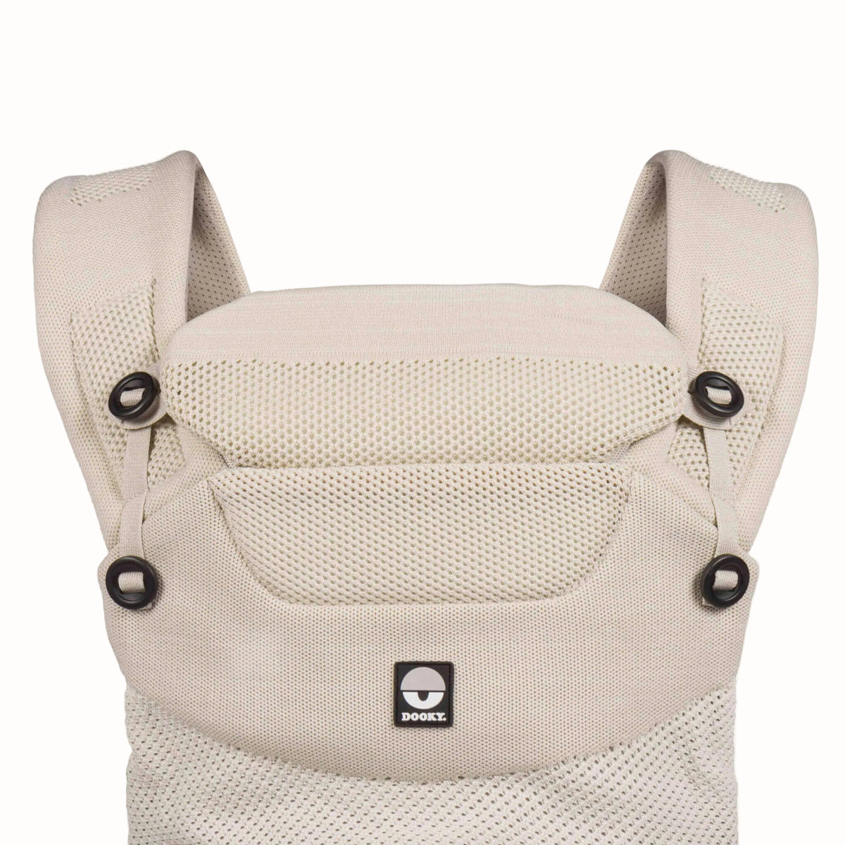 Front close-up of a beige baby carrier showing the padded head support, breathable mesh panels and shoulder strap attachments.