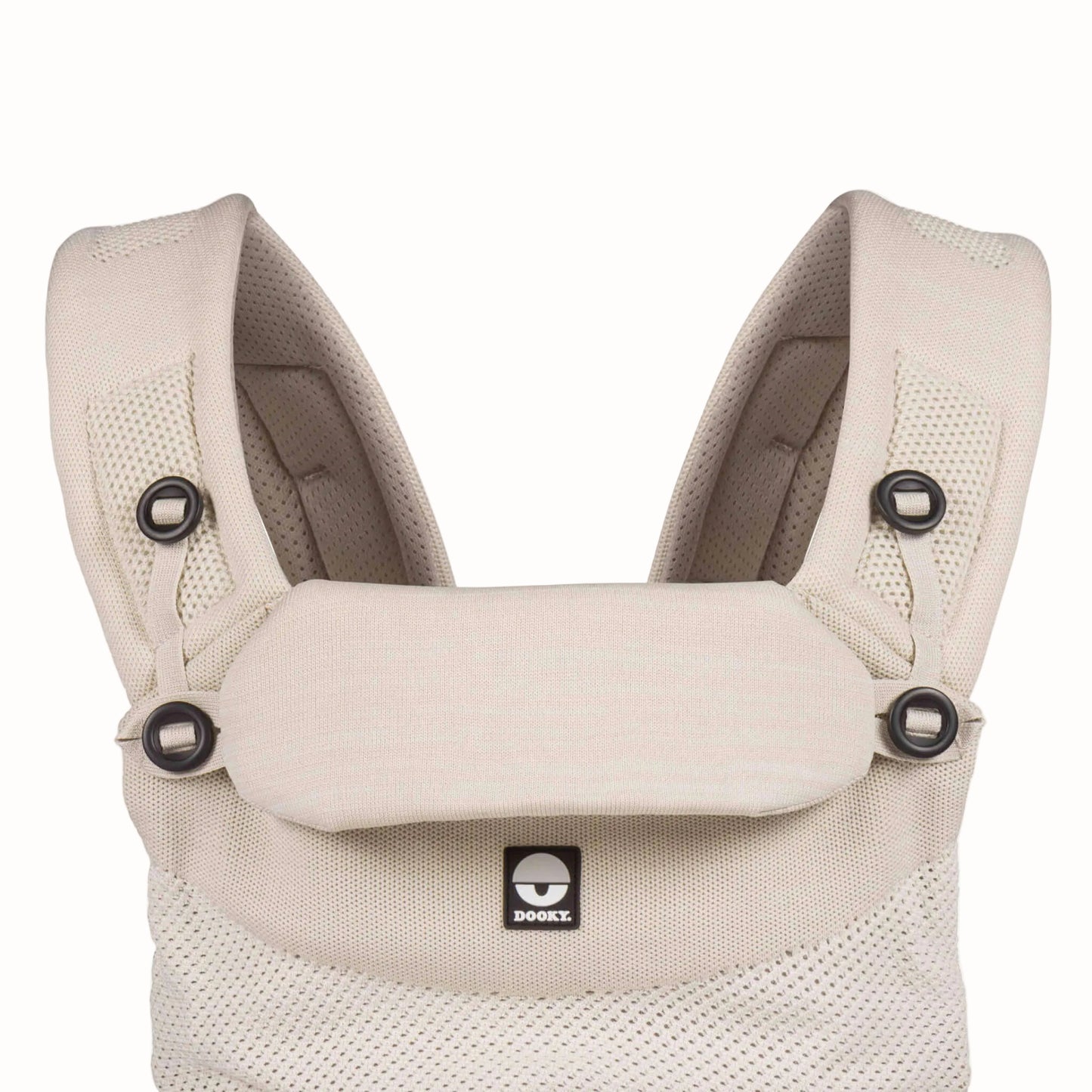 Beige baby carrier with the padded head support folded down, showing the adjustable shoulder straps and breathable knit fabric.