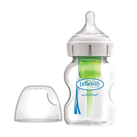 Dr Brown’s anti-colic baby bottle with green internal vent system and clear protective cap placed beside bottle on white background.
