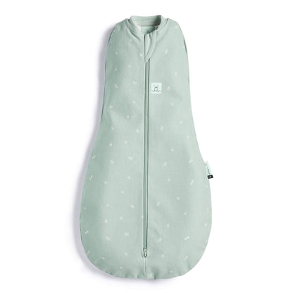 A soft green ErgoPouch Cocoon Swaddle Bag with a subtle white print, featuring a snug bell-shaped design and a secure zip-up front.