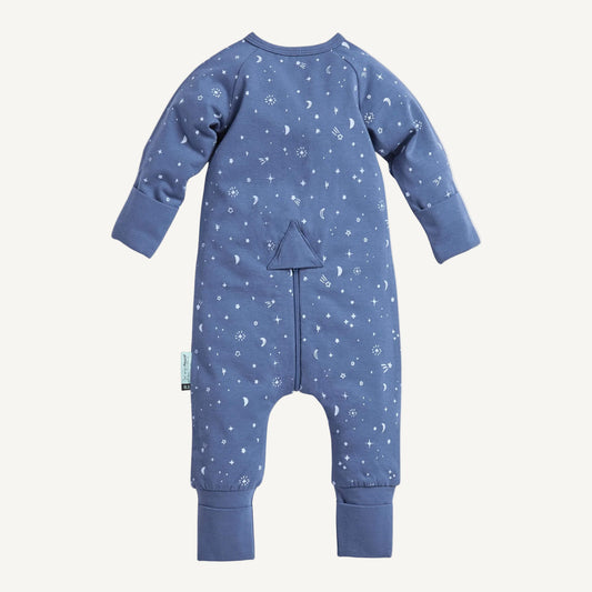 Back view of blue cotton babygrow with all-over moon and star print, fold-over cuffs and concealed zip detail.