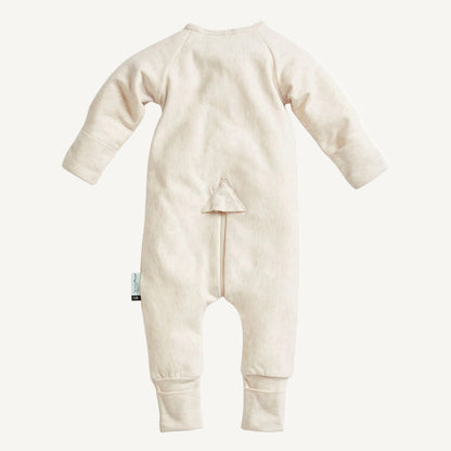 Back view of oatmeal cotton babygrow with slim fit design, fold-over cuffs and concealed zip detail.