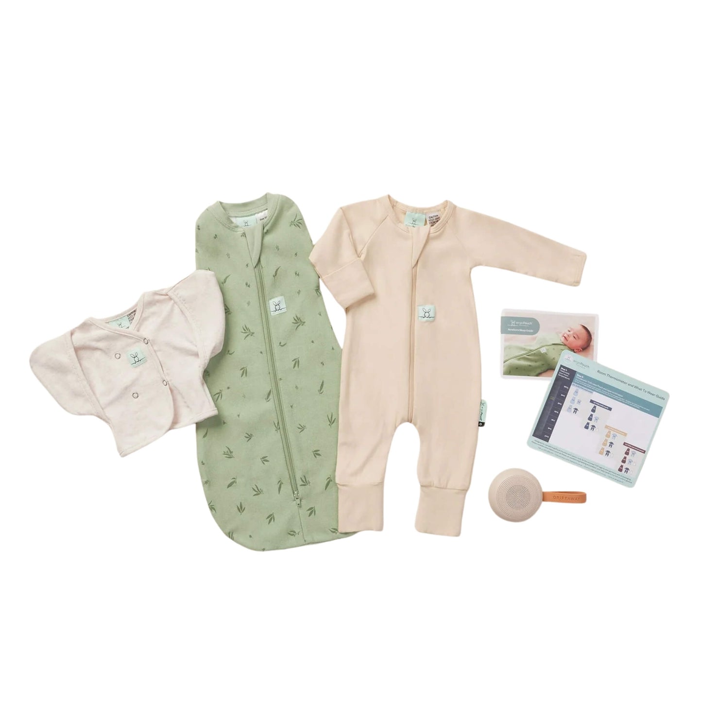A flat lay of the ErgoPouch Newborn Starter Pack in Willow, including a green printed swaddle bag, cream long-sleeve sleepsuit, soft newborn cardi, thermometer card, and white noise machine.