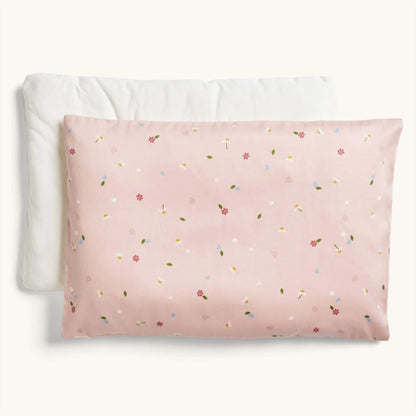 ErgoPouch Organic Toddler Pillow and Case in the Daisies print, showing a pink pillow with a delicate floral and leaf pattern, displayed with its insert.
