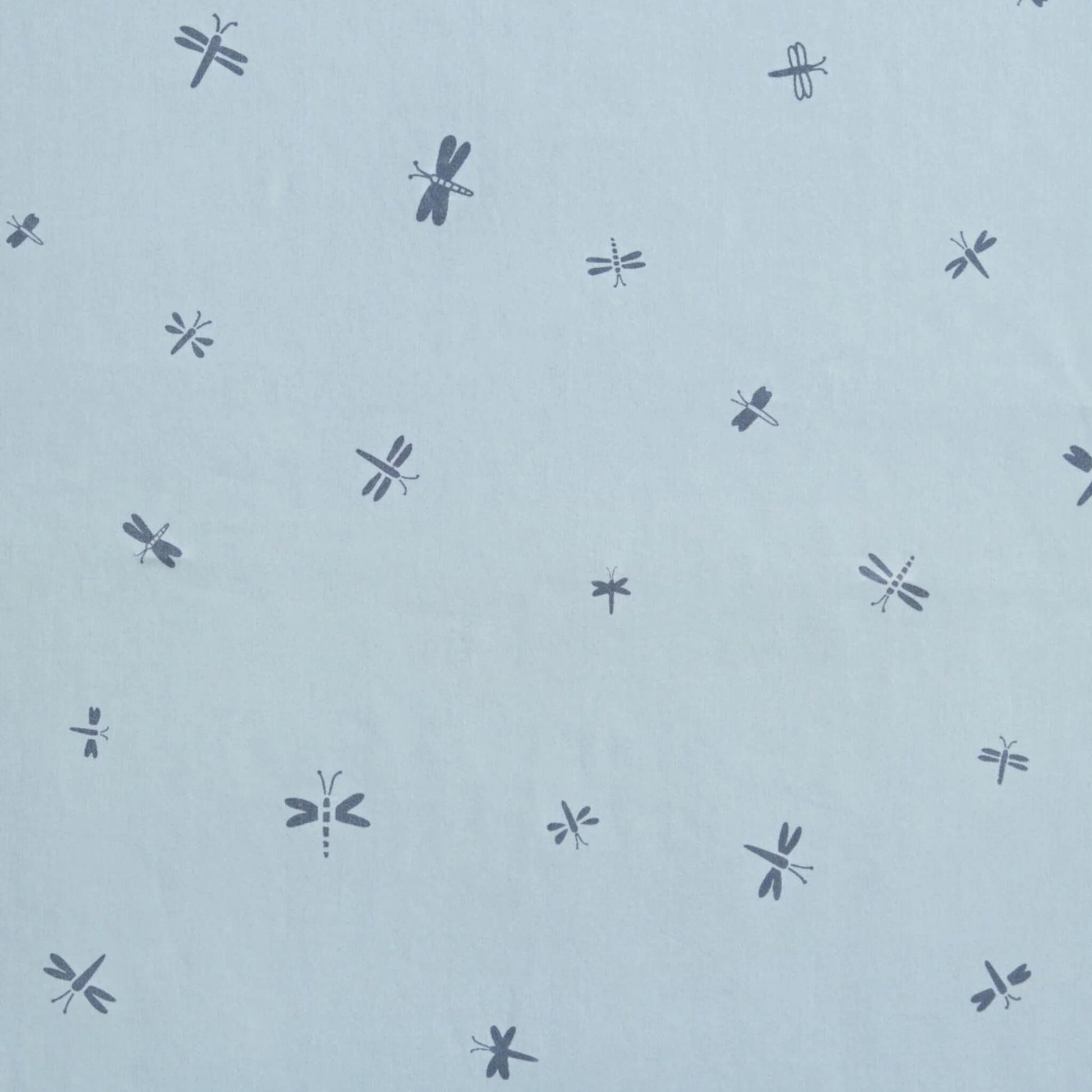 Close-up fabric view of the Dragonflies print showing scattered navy dragonflies on a pale blue background.