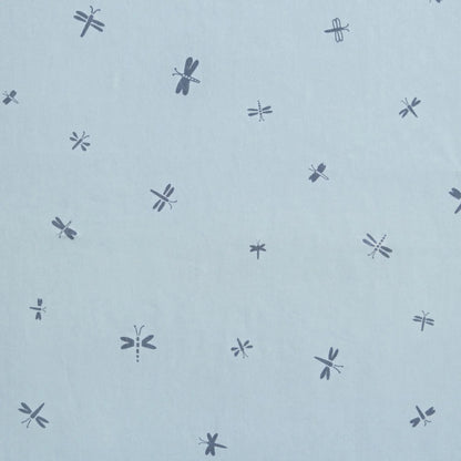 Close-up fabric view of the Dragonflies print showing scattered navy dragonflies on a pale blue background.