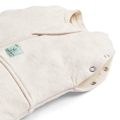 Close-up of  a winter weight 2.5 TOG baby swaddle bag in oatmeal, showing snap buttons and zip detail, made from organic, breathable fabric for winter warmth.