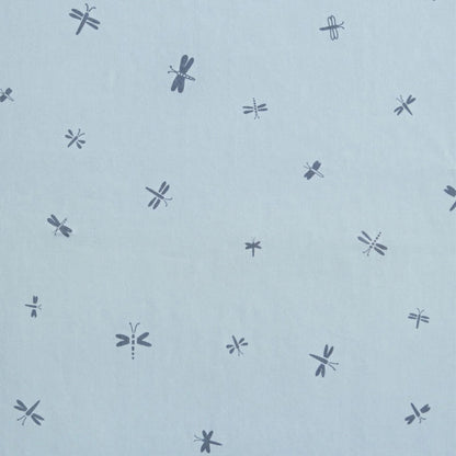 Close-up of the blue fabric on the ErgoPouch Sleeping Bag, featuring a delicate dragonflies print.