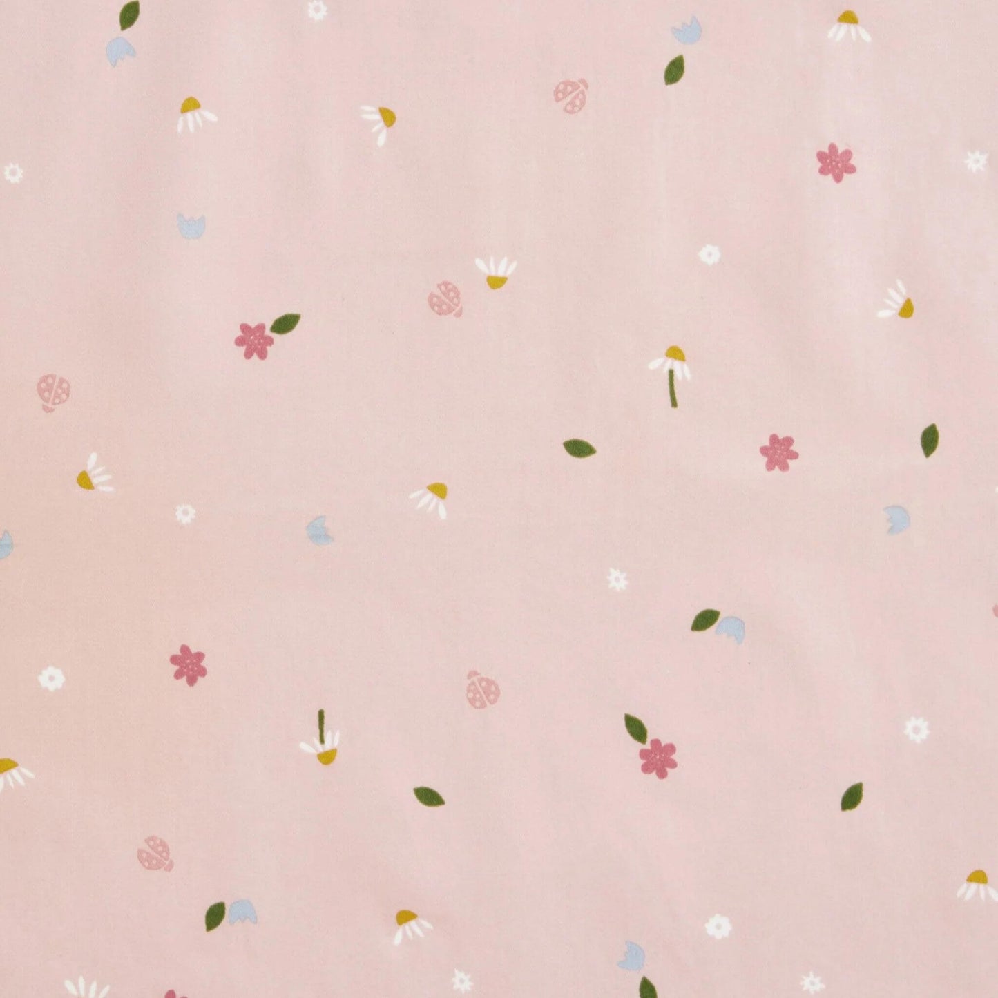 Close-up of a fabric swatch with a daisies print, featuring delicate flowers and ladybirds on a soft pink background.