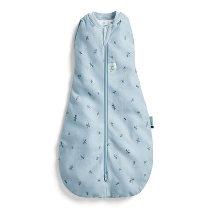 The ErgoPouch Cocoon Swaddle Bag in dragonflies print, featuring a soft blue fabric with delicate dragonfly motifs and a convenient zip design.