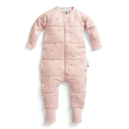 ErgoPouch Sleep Onesie in the Daisies print. It showcases its cosy, TOG-rated design with long sleeves and a zip-up front, made from soft, breathable organic cotton with a floral pattern.
