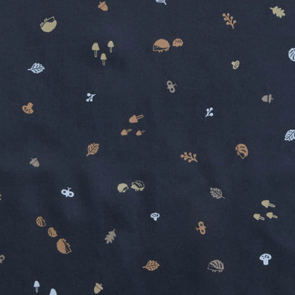 Close-up of the Hedgehog print on the ErgoPouch Sleep Onesie, featuring whimsical woodland elements like hedgehogs, acorns, leaves, and mushrooms.