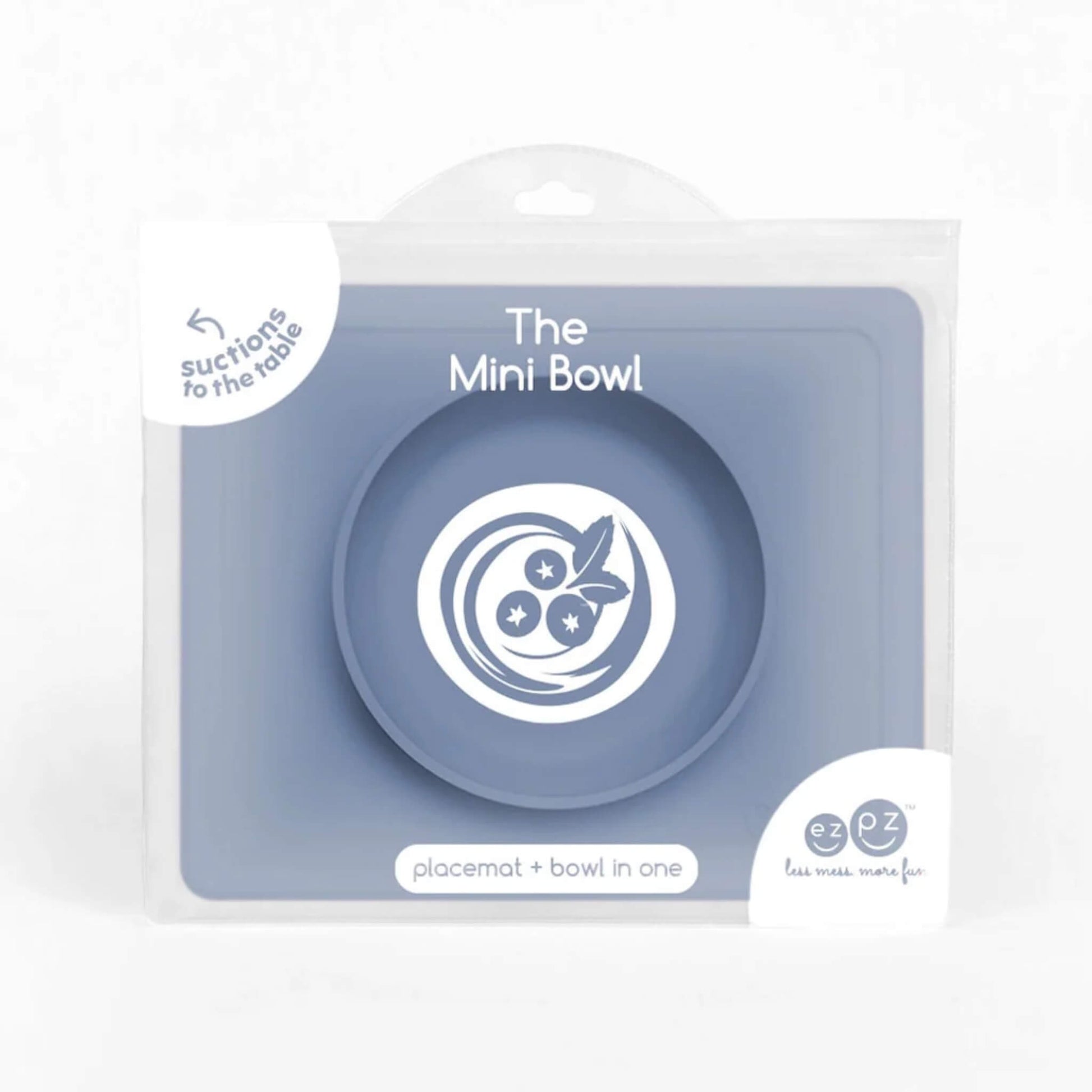 Indigo silicone mini suction bowl with built-in placemat, shown inside retail packaging with clear front display.